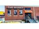 Exterior of The Works, a modern brick building with large windows and a stylish entrance at 1514 Gilstrap Nw Ln, Atlanta, GA 30318