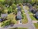 Neighborhood street view featuring well-maintained lawns and sidewalks winding past beautiful homes and manicured landscapes at 1710 Brandon Lee Sw Way, Marietta, GA 30008