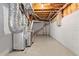 Unfinished basement featuring exposed pipes, ductwork, and concrete floor at 1710 Brandon Lee Sw Way, Marietta, GA 30008