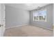 Neutral bedroom featuring a large window allowing for ample natural light at 1710 Brandon Lee Sw Way, Marietta, GA 30008