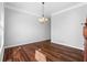 Dining room with hardwood floors, chandelier, and lots of natural light creating an inviting space at 1710 Brandon Lee Sw Way, Marietta, GA 30008
