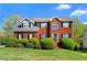 Beautiful two-story brick home with a manicured lawn and blue sky, creating an inviting curb appeal at 1710 Brandon Lee Sw Way, Marietta, GA 30008