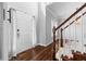 Bright foyer featuring hardwood floors, staircase, and a view of the home's tall ceilings at 1710 Brandon Lee Sw Way, Marietta, GA 30008