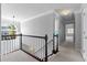 Upstairs hallway featuring carpet, and natural light at 1710 Brandon Lee Sw Way, Marietta, GA 30008