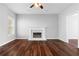 Bright living room featuring a fireplace, hardwood floors, and ample natural light at 1710 Brandon Lee Sw Way, Marietta, GA 30008