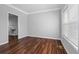 Bright and airy living room featuring hardwood floors, grey walls and white trim at 1710 Brandon Lee Sw Way, Marietta, GA 30008