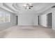 Spacious main bedroom with tray ceiling, and multiple doorways at 1710 Brandon Lee Sw Way, Marietta, GA 30008