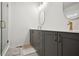 Elegant bathroom with dual sinks, modern fixtures, and a walk-in shower at 203 Color Cir, Atlanta, GA 30317
