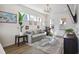 Bright living room with contemporary decor, large windows, and hardwood flooring at 203 Color Cir, Atlanta, GA 30317