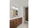 Bathroom with a double vanity featuring granite countertops and wood cabinets at 5310 Julep Ct, Cumming, GA 30028