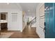 Inviting entryway with hardwood floors flows into the open floor plan and staircase with natural light at 5310 Julep Ct, Cumming, GA 30028