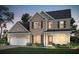Charming two-story brick home with a well-manicured lawn and a two-car garage at 5310 Julep Ct, Cumming, GA 30028