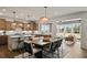 A kitchen and dining area with a large island, stainless steel appliances, and hardwood floors at 5310 Julep Ct, Cumming, GA 30028