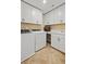 Laundry room equipped with a washer, dryer, white cabinets, and countertops at 5310 Julep Ct, Cumming, GA 30028