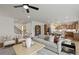 Bright open-concept living space with kitchen access, featuring modern furnishings and decor at 5310 Julep Ct, Cumming, GA 30028