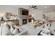 Comfortable living room with brick fireplace, modern furnishings, and ample natural light at 5310 Julep Ct, Cumming, GA 30028