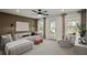 Spacious living room featuring a comfortable sofa, neutral color scheme, and ample natural light at 5310 Julep Ct, Cumming, GA 30028