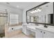 Bathroom with double vanity sinks, a soaking tub, tiled shower, and large mirror for a spa-like experience at 44 Hall Mnr, Alpharetta, GA 30022