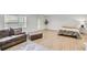 Spacious bedroom featuring a comfortable seating area, ottoman, and a bright window at 44 Hall Mnr, Alpharetta, GA 30022