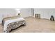 Bright bedroom with a cozy bed, side table with lamp, and ample floor space at 44 Hall Mnr, Alpharetta, GA 30022