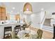 Dining area featuring modern decor and a view of kitchen with a bar and stairway at , Alpharetta, GA 30022