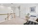 Bright hallway featuring plush carpeting, stairs with wooden handrail, and a doorway, with a neutral color palette at 44 Hall Mnr, Alpharetta, GA 30022