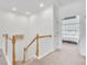 Upstairs hallway leading to a bedroom, featuring carpeted floors and neutral paint at 44 Hall Mnr, Alpharetta, GA 30022