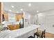 Bright kitchen featuring stainless steel appliances, light wood cabinets, and a breakfast bar with seating at 44 Hall Mnr, Alpharetta, GA 30022