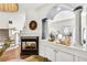 Inviting living room showcasing a fireplace and view of the staircase at 44 Hall Mnr, Alpharetta, GA 30022