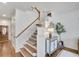 Stairway featuring neutral walls and wooden accents, leading to the upper level of the home at 44 Hall Mnr, Alpharetta, GA 30022