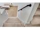 A carpeted staircase with custom handrail, offering access to different levels of the home at 44 Hall Mnr, Alpharetta, GA 30022