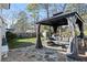 Outdoor patio featuring a stone surface, covered seating area, and a cozy setting for outdoor entertaining and relaxation at 1926 Canmont Ne Dr, Brookhaven, GA 30319