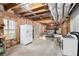 Spacious unfinished basement featuring exposed insulation, wood beams, and potential for versatile use at 3550 Myrtlewood Chase Nw, Kennesaw, GA 30144