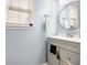 Bathroom features include stylish vanity with round mirror and natural light at 3550 Myrtlewood Chase Nw, Kennesaw, GA 30144