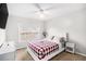 Bright bedroom features carpet, large windows, and a ceiling fan at 3550 Myrtlewood Chase Nw, Kennesaw, GA 30144