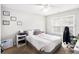 This bedroom features carpet, a bed, a large window for plenty of light, and artwork at 3550 Myrtlewood Chase Nw, Kennesaw, GA 30144