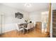 Dining room with wood floors, neutral walls, and a staircase in the background at 3550 Myrtlewood Chase Nw, Kennesaw, GA 30144