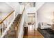 Inviting entryway with hardwood floors, staircase and modern design details at 3550 Myrtlewood Chase Nw, Kennesaw, GA 30144