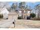 Charming two-story home featuring a manicured lawn, brick accents, and a spacious two-car garage at 3550 Myrtlewood Chase Nw, Kennesaw, GA 30144