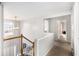 Upstairs hallway with natural light and neutral carpet at 3550 Myrtlewood Chase Nw, Kennesaw, GA 30144