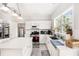 Well-lit kitchen featuring white cabinets, stainless steel appliances, and a tile backsplash at 3550 Myrtlewood Chase Nw, Kennesaw, GA 30144