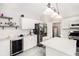 Modern kitchen with stainless steel appliances, white cabinets, and center island at 3550 Myrtlewood Chase Nw, Kennesaw, GA 30144