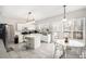 Bright kitchen with white cabinetry, an island, stainless steel appliances, and modern lighting at 3550 Myrtlewood Chase Nw, Kennesaw, GA 30144