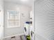 Laundry room with modern washer and dryer and patterned tile floor at 3550 Myrtlewood Chase Nw, Kennesaw, GA 30144