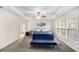 Large main bedroom with tray ceiling, multiple windows, and sitting area at 3550 Myrtlewood Chase Nw, Kennesaw, GA 30144
