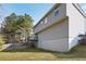 Spacious backyard with a grassy lawn and a view of the home's exterior at 6595 Lancelot Ct, Riverdale, GA 30296