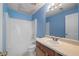 Full bathroom with blue walls, a shower-tub combination, and a tiled floor at 6595 Lancelot Ct, Riverdale, GA 30296