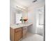 Bathroom featuring wood cabinets, countertop space, and a view into a bedroom at 6595 Lancelot Ct, Riverdale, GA 30296