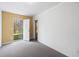 Bedroom with carpet flooring and an exterior door with access to the backyard at 6595 Lancelot Ct, Riverdale, GA 30296