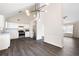 Open kitchen featuring white cabinets, stainless steel appliances, and dark laminate flooring at 6595 Lancelot Ct, Riverdale, GA 30296